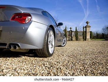 Sliver Sports Car On Driveway