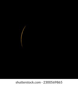 Sliver of Sun peaks out behind moon during eclipse - Powered by Shutterstock