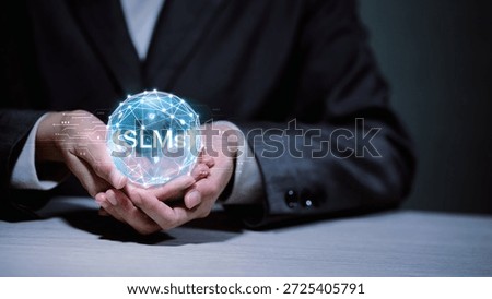 SLMs Small Language Models and artificial intelligence concept. Businessman holding glowing network globe with SLMs text. Innovation in machine learning and NLP technology.