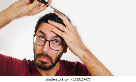 Slobby Man Who Has Been In Quarantine Too Long Attempting To Cut His Own Hair.