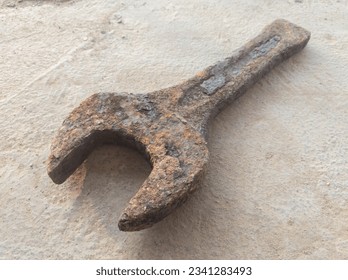 slogging ring spanner wrench open end old, rusty and dirty