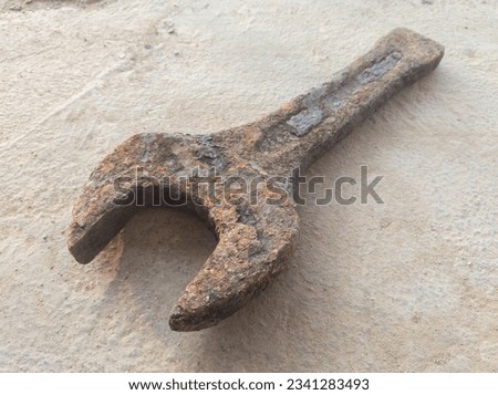 slogging ring spanner wrench open end old, rusty and dirty