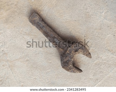 slogging ring spanner wrench open end old, rusty and dirty