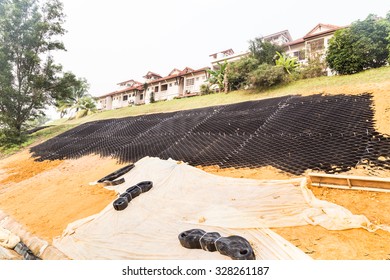 Slope Erosion Control With Grids And Earth On Steep Slope.