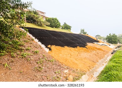 Slope Erosion Control With Grids And Earth On Steep Slope.