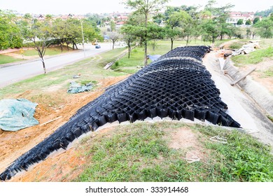 Slope Erosion Control With Grids And Earth On Steep Slope At A Residential Community