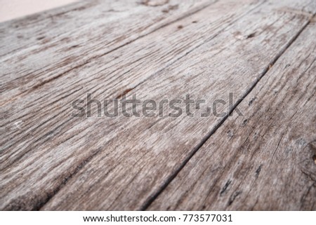 Slope pattern of closeup surface of dry and dirty wooden board background, selective focus.