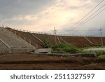 sloped embankment with a retaining wall