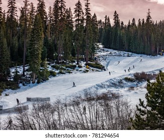 The Slopes Of Northstar Ski Resort, In The Sierra Nevada Mountains Of Truckee California, Near Lake Tahoe, With Skiers (and Snowboarders) Skiing The Ski Runs In The Late Afternoon, Before Sunset  