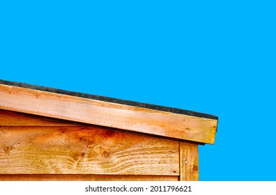A slopping wooden shed roof to let the rain water run off the roof, roofing felt is use to prevent the rain water entering the shed and protect the wood - Shutterstock ID 2011796621