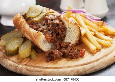 Sloppy Joe's Ground Beef Sandwich Wit Pickles And French Fries