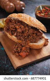 Sloppy Joe's Ground Beef Sandwich Served On Wooden Board