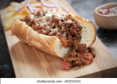 Sloppy Joes Ground Beef Sandwich Served With Onion And French Fries