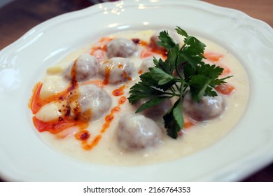 Slops meatballs on the dinner plate. - Shutterstock ID 2166764353