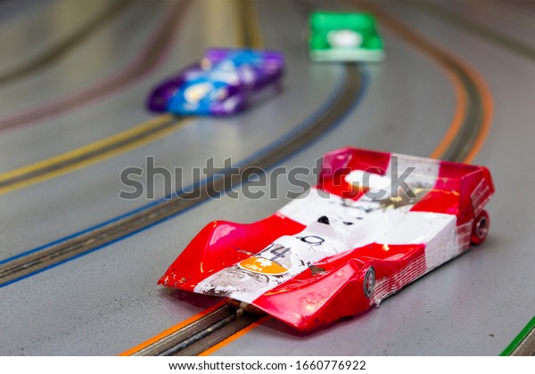 Slot car racing\
track with slot cars cars