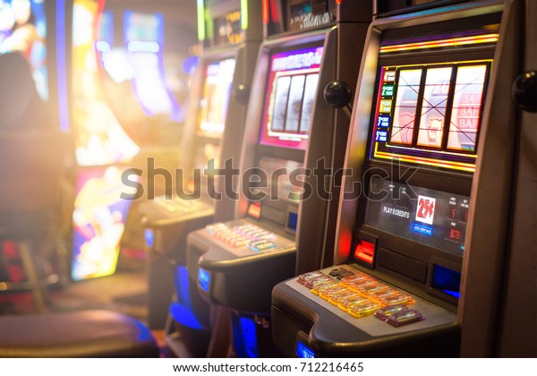Slot machines in a casino. Gambling and arcade\
games concept.