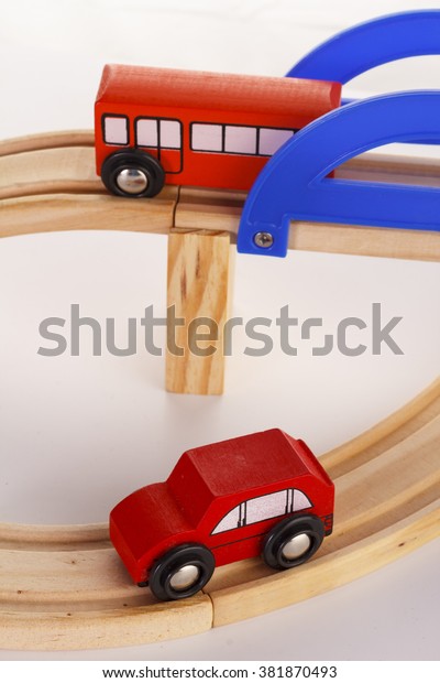 A slot wooden cars race set on a track over\
white background