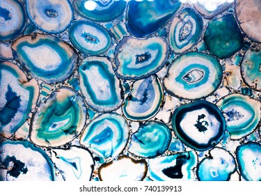 Slots of the colorful blue polished agate. Natural abstract background