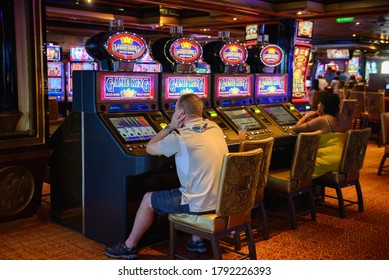 Slots Machines At The Casino Games. Game King Slots. People Playing Casino Games On A Cruise Ship. Carnival Cruise Line. Miami, May 23, 2020