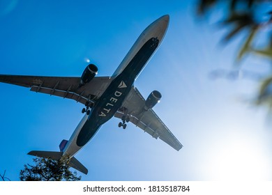 Slough, UK - August 21 2020: Great Close Up Of Delta Airways Plane Flying Overhead.