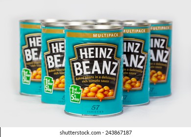 SLOUGH, UK - JANUARY 11, 2014: Six Cans Of  415g Heinz Baked Beans. The H. J. Heinz Company Manufactures Thousands Of Food Products In Plants On Six Continents.