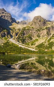 Slovak Tatra mountains. Mountain scenery. Valley green pond. Peaks against the sky.
