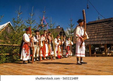 Ä?iÄ�many, Slovakia - circa September 2009: Young man dressed in folk costume plays fujara at Festival of shepherd's pipesl in Ä?iÄ�many. Documentary editorial.