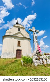 Slovakia - The Holy cross baroque chapel on the hill Siva brada in Spis region and little girl.