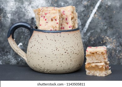 Slovenian Handmade Ceramic Cup And Homemade Snickers Bars With White Chocolate