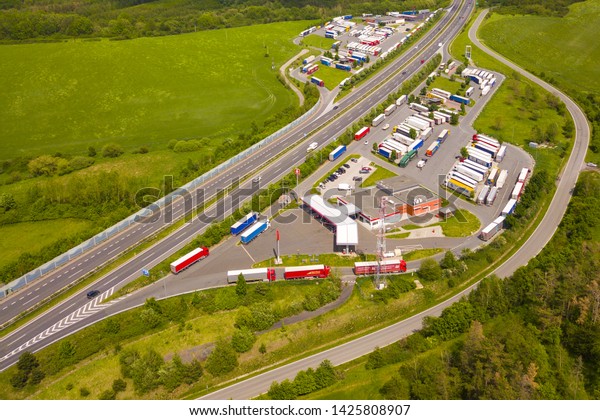 SLOVICE, CZECH REPUBLIC - MAY 26, 2019: Aerial view of\
highway rest area with restaurant and large car park for cars and\
trucks. D5 motorway in west Bohemia, Czech republic, European\
union. 