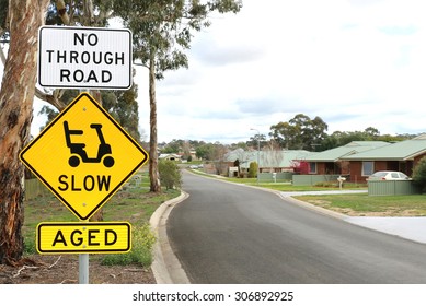 Slow And Aged Signs At The Entrance Of A Retirement Village