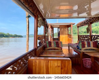 Slow Boat Cruising On The Mekong River In Luang Prabang, Laos