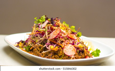 Slow Braised Pulled Pork Shoulder Salad With Charred Corn, Radish, Apple, Coriander, Mint And Rice Wine Pickle Dressing