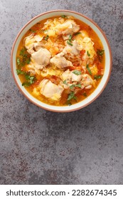 Slow cooked Bhutanese Spicy Chicken Stew Jasha Maroo closeup on the bowl on the table. Vertical top view from above - Shutterstock ID 2282674345