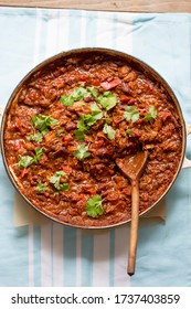 Slow Cooked Chipotle Chicken. Chicken With Cumin, Smoked Paprika, Red Peppers, Red Onions, Guacamole And Sour Cream, Coriander. 