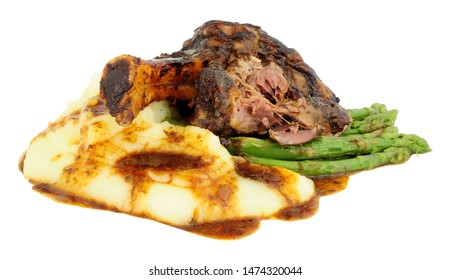 Slow Cooked Lamb Shank Meal With Creamy Mashed Potato And Asparagus Isolated On A White Background