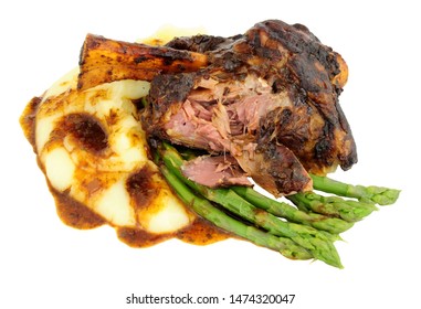 Slow Cooked Lamb Shank Meal With Creamy Mashed Potato And Asparagus Isolated On A White Background