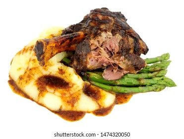 Slow Cooked Lamb Shank Meal With Creamy Mashed Potato And Asparagus Isolated On A White Background