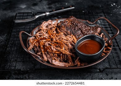 Slow Cooked Pulled Beef, Traditional meat rubbed with spices and smoked in a Texas smoker. Black background. Top view. - Shutterstock ID 2272654481
