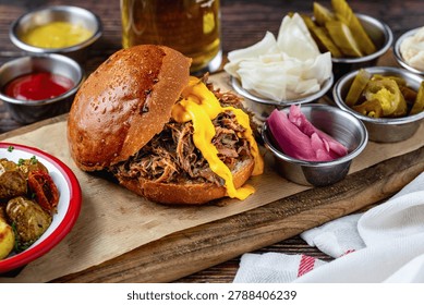 Slow cooked pulled rib beef burger with melted cheese and sides