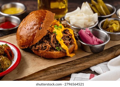 Slow cooked pulled rib beef burger with melted cheese and sides