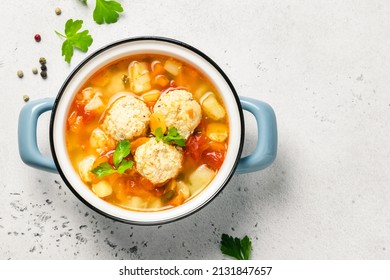 Slow Cooker Meatball Soup In Pot. Top View, Copy Space.