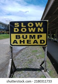 Slow Down Bump Ahead Signage 