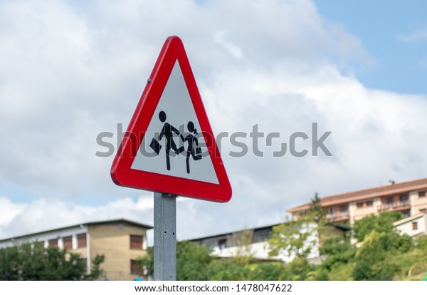 Slow Down, School ahead\
traffic sign
