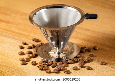 Slow drip coffee filter metal cone - Wood Background