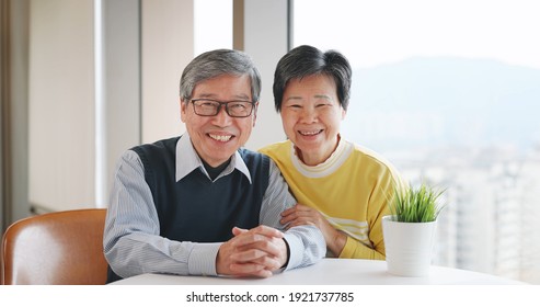 Slow Motion Of Asian Senior Couple Smile At You Near Window At Home