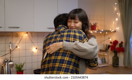 Slow Motion Of Excited Couple Looking At Pregnancy Test Result At Home And Hugging Each Other With Joy After Finding They Are Going To Have A Baby