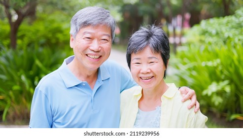 Slow Motion Video - Authentic Shot Of Asian Elderly Couple Smile At You Outdoor In Close Up