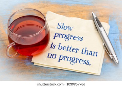 Slow progress is better than no progress inspirational note - handwriting on a napkin with a cup of coffee - Shutterstock ID 1039957786