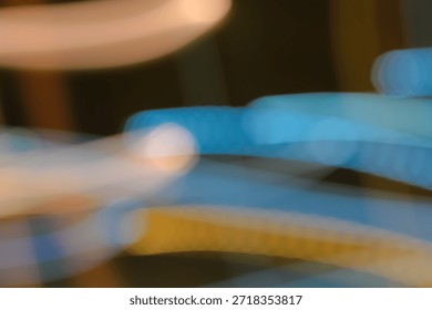 Slow Shutter Speed Creates Motion Blur Abstract with Blue and Yellow Lines, Suggesting Speed and Movement, Suitable for Backgrounds